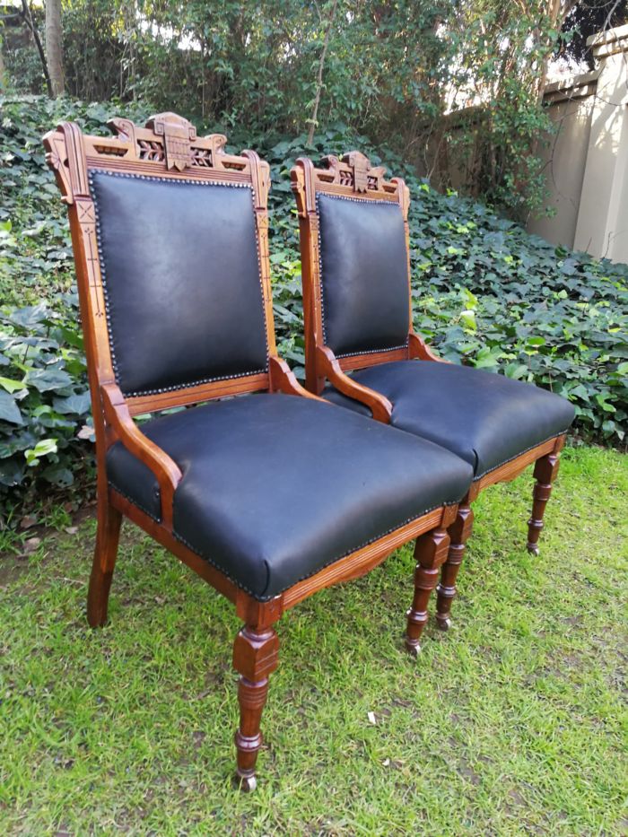 A Late 19th Century Pair of Victorian Carved Walnut Chairs Upholstered in Leather on Casters - Image 4