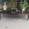 A three meter Victorian mahogany extending dining table on carved legs and castors, with four leaves and crank - Image 3