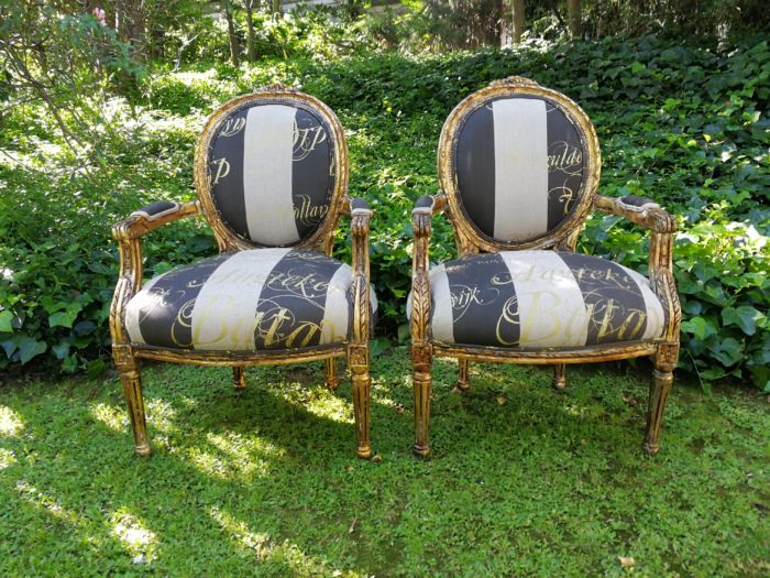 A Pair of French Style Arm Chairs Hand Gilded With Gold Leaf And Upholstered In an Imported Script Fabric - Image 2