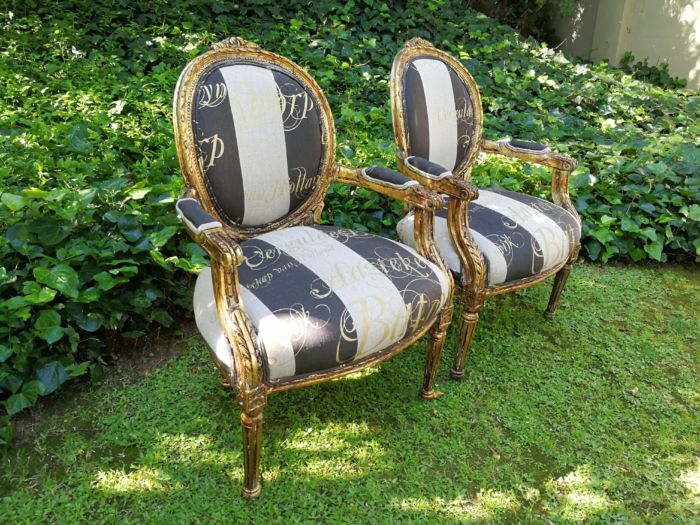 A Pair of French Style Arm Chairs Hand Gilded With Gold Leaf And Upholstered In an Imported Script Fabric - Image 4