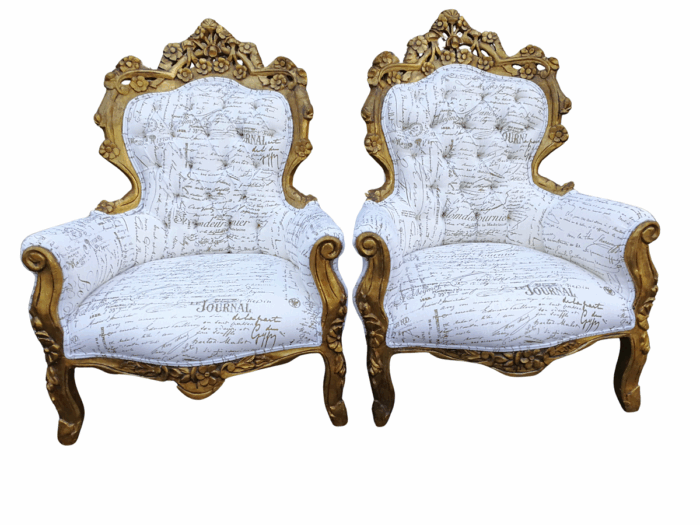 A Pair Of French Baroque Ornately Carved Gilded Arm Chairs Upholstered in an Exclusive and Custom-made Hand Printed Imported Linen for The Crown Collection