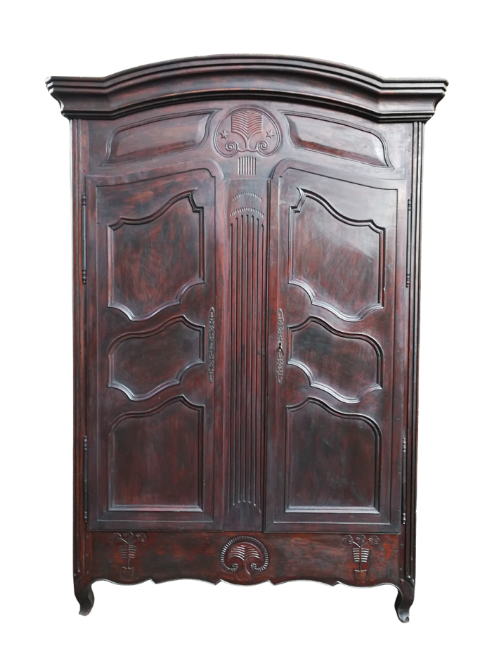 An 18th Century/early 19th Century French Walnut Dauphinoise armoire from the North of Lyon which has both Louis XV and Louis XVI elements