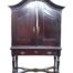 A 19th Century Cape oak cabinet on stand with shelves and small drawers