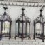 A Set Of Three Large Size Vintage Wrought-Iron Hanging Lanterns For Candles With Drip Trays ND