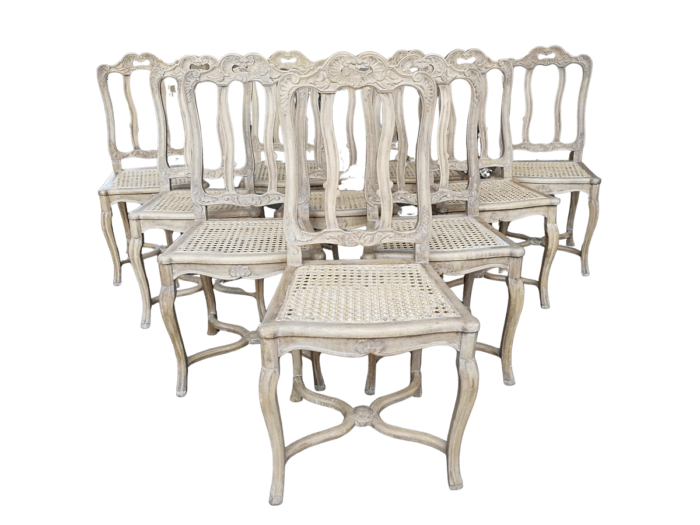 A Set Of Ten Antique French Provincial Carved Bleached / Natural Oak Dining Chairs With Rattan Seats.  Circa 1860-1900’s