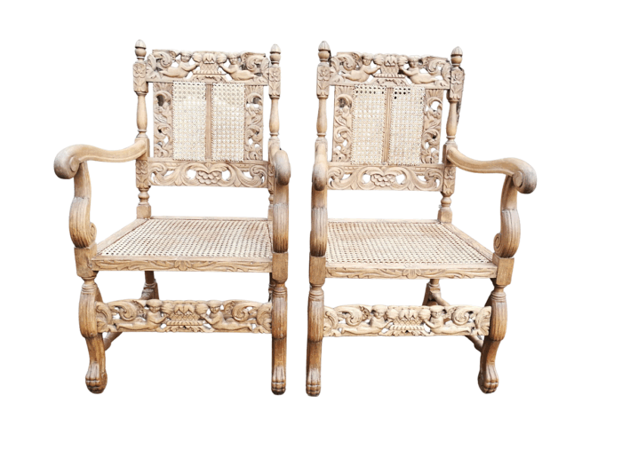 A Pair Or Ornately Carved And Bleached / Natural Wood Finish With Redone Rattan Arm Chairs