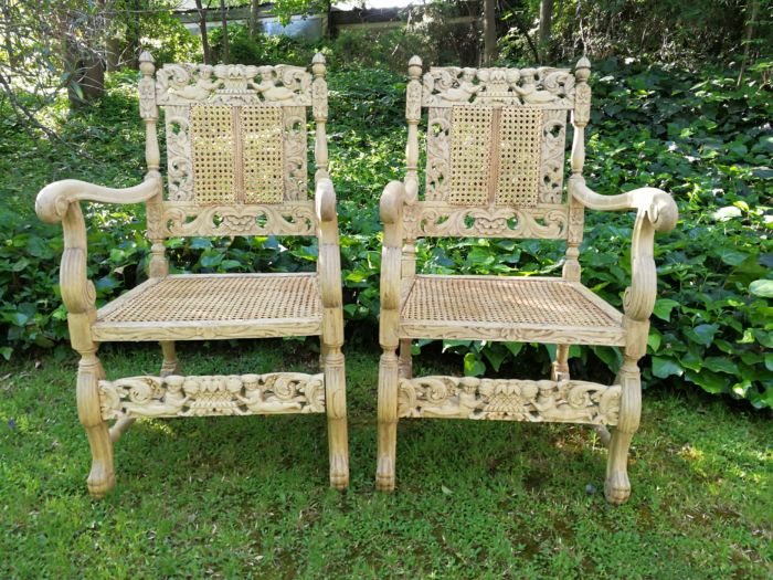 A Pair Or Ornately Carved And Bleached / Natural Wood Finish With Redone Rattan Arm Chairs - Image 2