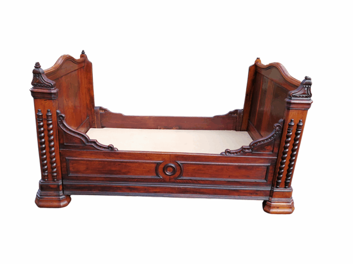 A Carved Mahogany Lit-Bateau