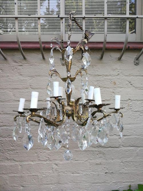 A French Brass Chandelier With French Crystals And Prisms