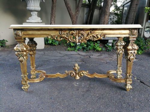 A decorative and ornate entrance/console/drinks table