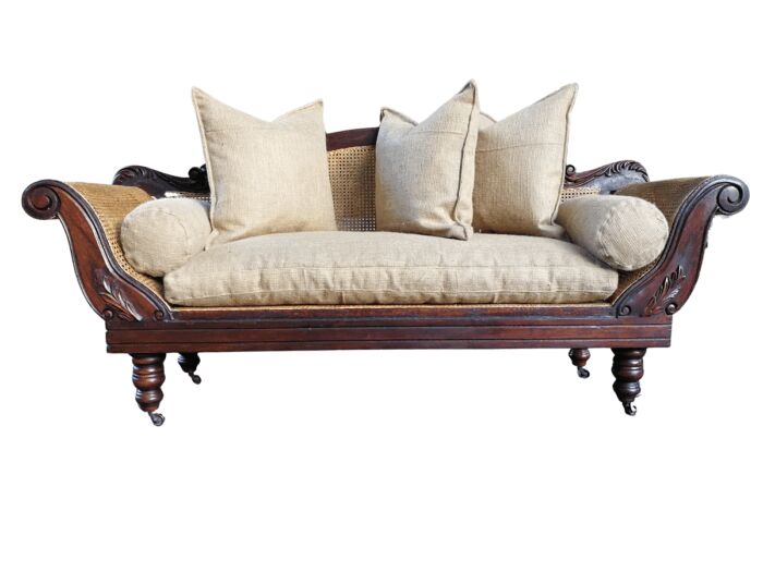 An Antique Victorian Carved Mahogany and Rattan Settee On Castors with Hessian Cushions and Bolsters