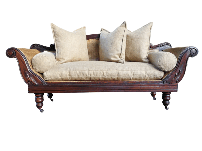 An Antique Victorian Carved Mahogany and Rattan Settee On Castors with Hessian Cushions and Bolsters