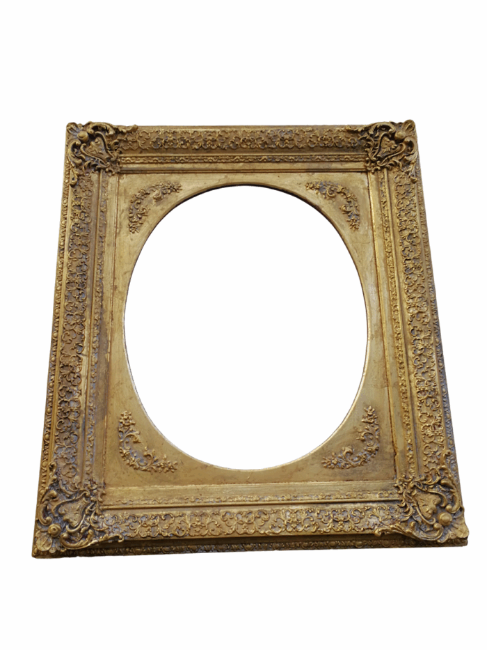 An Early 20th Century Gilded Oval Mirror Within A Rectangular Frame