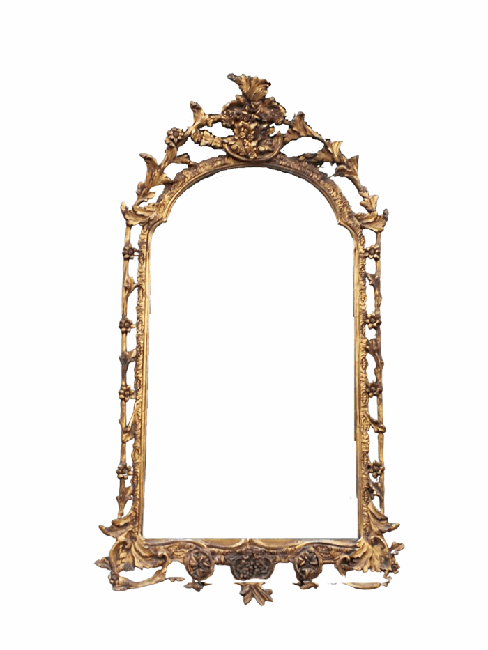 An Ornately Carved and Giltwood Mirror ND