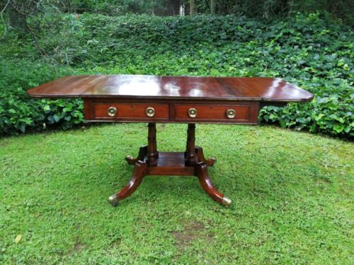 A Regency Mahogany Sofa Table On Brass Castors With Brass