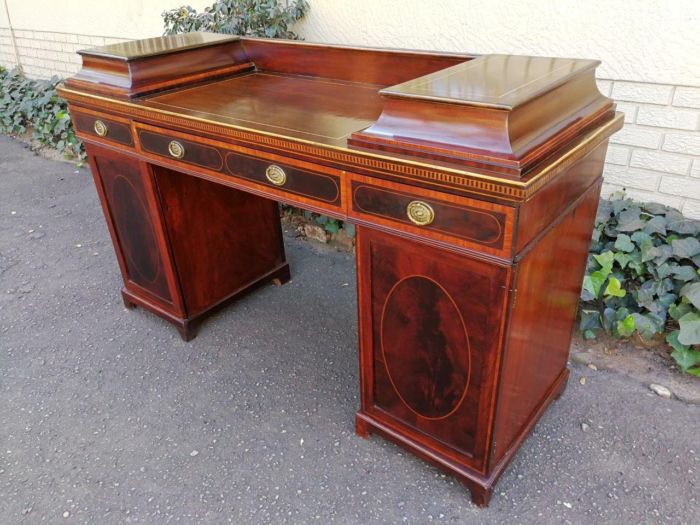 A Late Regency Inlaid Mahogany and Rosewood Pedestal Sideboard, fitted with original oval foliate brass escutcheons and loop handles and with a cellarette drawer - Image 3