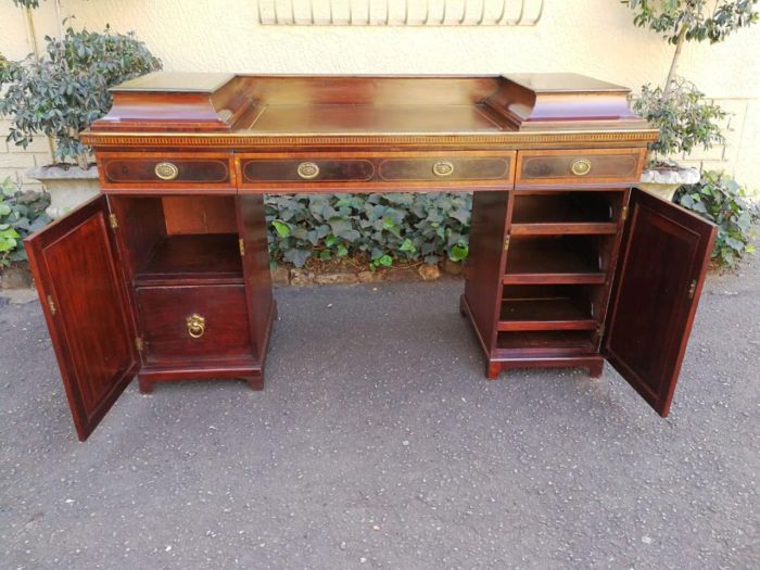 A Late Regency Inlaid Mahogany and Rosewood Pedestal Sideboard, fitted with original oval foliate brass escutcheons and loop handles and with a cellarette drawer - Image 7