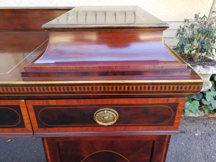 A Late Regency Inlaid Mahogany and Rosewood Pedestal Sideboard, fitted with original oval foliate brass escutcheons and loop handles and with a cellarette drawer - Image 10
