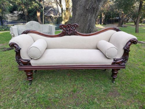 A Victorian Mahogany Settee In A Contemporary Wood Finish With Castors