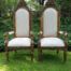 An Intricately Carved Pair of French Baroque/Rococo Style King/Throne Gold Painted Armchairs Upholstered in a Custom Handmade Imported Linen with Gold Design for The Crown Collection