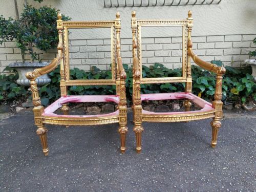 A Pair of French Style Ornately Carved and Gilded Armchairs ND