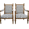 A Pair of French Style Ornately Carved and Gilded Armchairs ND