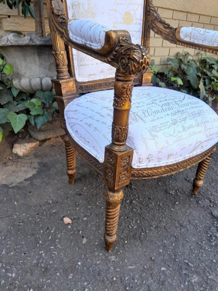 A Pair of 20th Century French Style Carved and Hand Gilded Armchairs Upholstered in a Custom and Handmade Gold Script Linen for The Crown Collection - Image 8