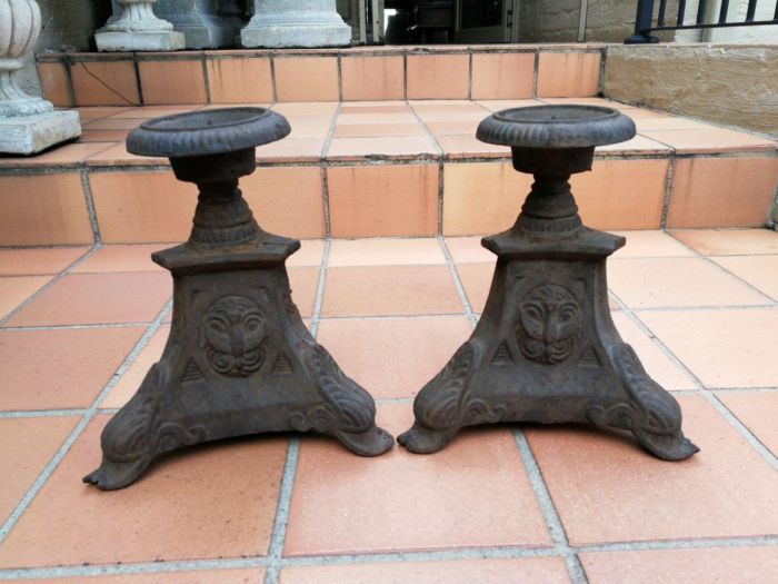 A Pair Of 20th Century French Cast Iron Candle Holders