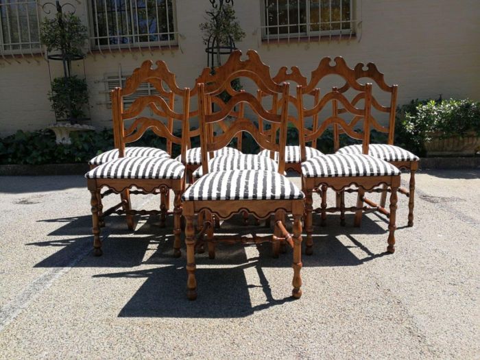A Set Of Eight Carved Dining Chairs