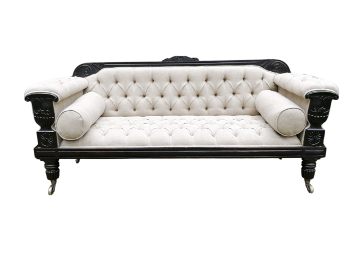 A 20TH Century English Rosewood Settee On Castors and Upholstered in an Imported Linen with Deep Button Detail and Bolster Cushions