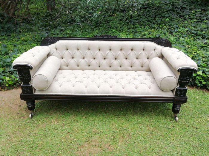 A 20TH Century English Rosewood Settee On Castors and Upholstered in an Imported Linen with Deep Button Detail and Bolster Cushions - Image 2