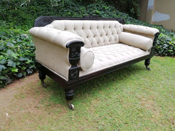 A 20TH Century English Rosewood Settee On Castors and Upholstered in an Imported Linen with Deep Button Detail and Bolster Cushions - Image 3