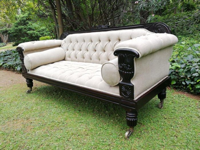 A 20TH Century English Rosewood Settee On Castors and Upholstered in an Imported Linen with Deep Button Detail and Bolster Cushions - Image 4