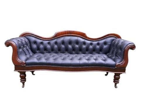 An Antique 19th Century Walnut Settee On Castors Upholstered In A Deep Buttoned Leather