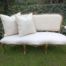 A 20th Century Carved And Hand-Gilded French Style Settee Upholstered In An Imported Linen