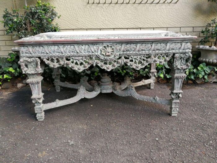A Rare French Style Ornately Carved Entrance Table With White Marble Inlaid Top Of Large Proportion