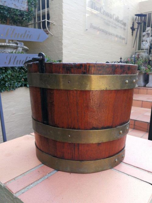A 20th Century Teak Water Bucket with Brand Bands and Iron Handle ND