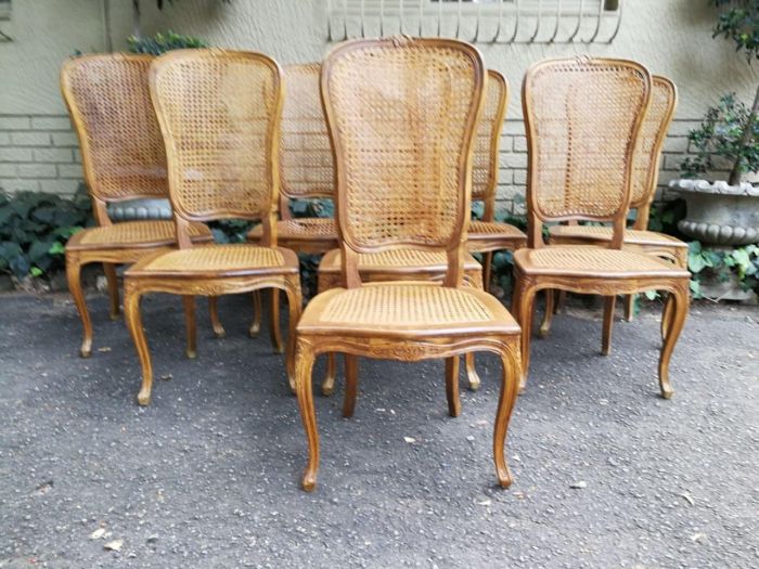 A 20th Century Circa Mid 1950s Set Of Eight French Carved Oak Dining Chairs