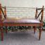 A 20th Century French Carved Mahogany Ottoman With Gilt Tooled Brown Leather