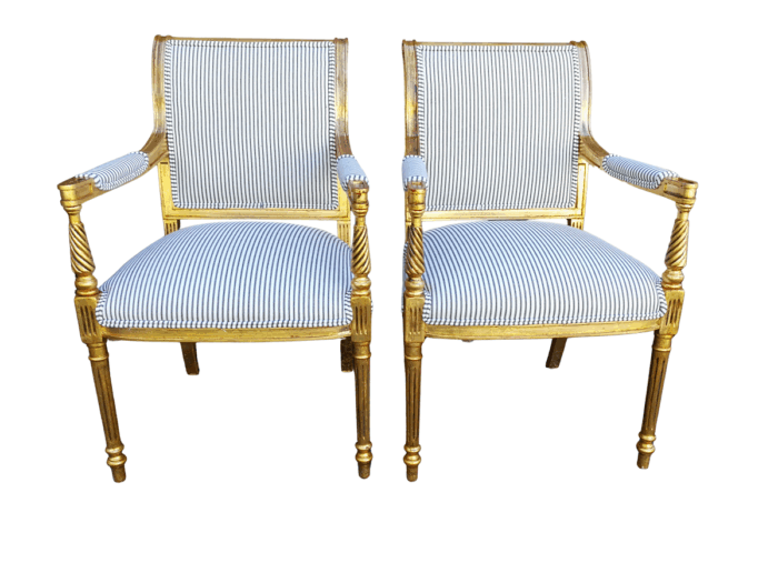 A Pair Of Carved And Gilded Armchairs