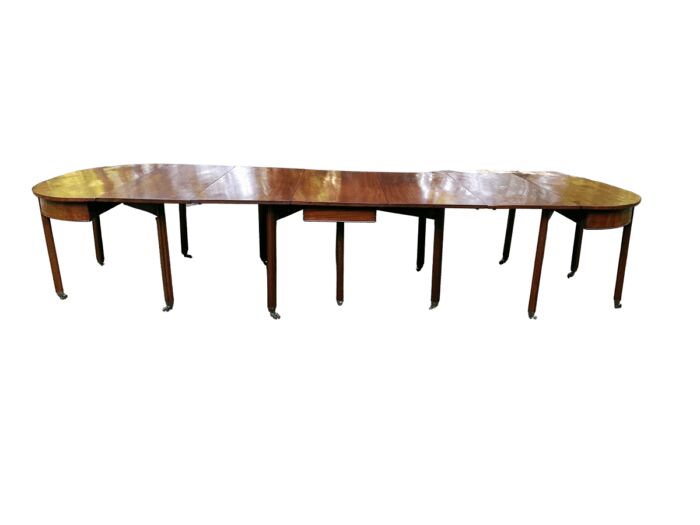 A 19TH Century Circa 1810 George III Mahogany Extension Dining Table with Brass Castors (12-14 Seater)