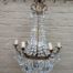 A 20th Century French Style Empire Brass and Crystal Chandelier