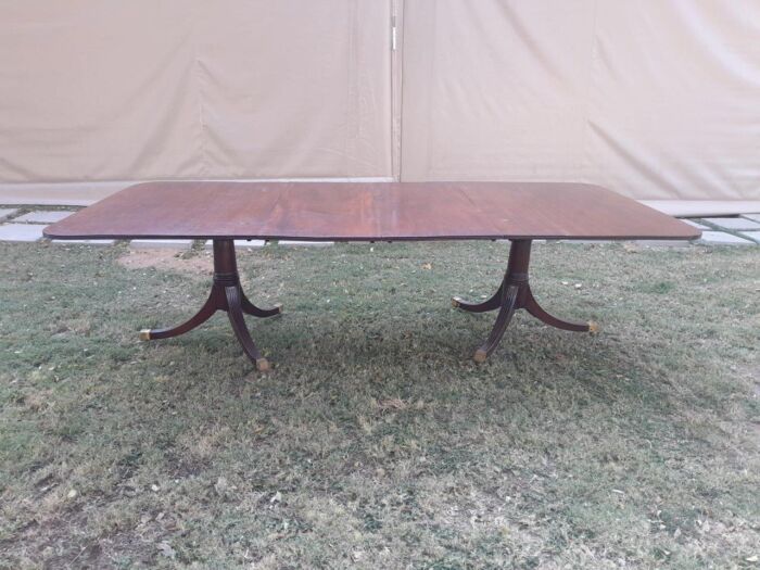 A 20th Century Mahogany Dining Table with Two Extensions and Brass Feet & Casters - Image 2
