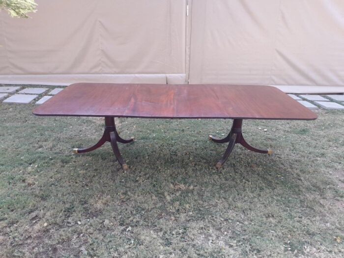 A 20th Century Mahogany Dining Table with Two Extensions and Brass Feet & Casters - Image 3