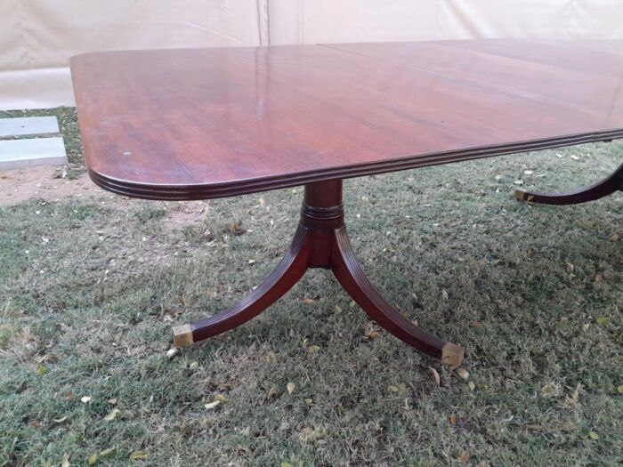 A 20th Century Mahogany Dining Table with Two Extensions and Brass Feet & Casters - Image 11