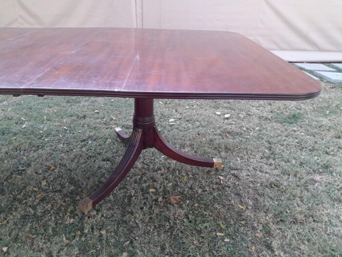 A 20th Century Mahogany Dining Table with Two Extensions and Brass Feet & Casters - Image 12