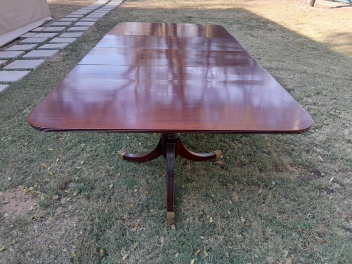 A 20th Century Mahogany Dining Table with Two Extensions and Brass Feet & Casters - Image 13