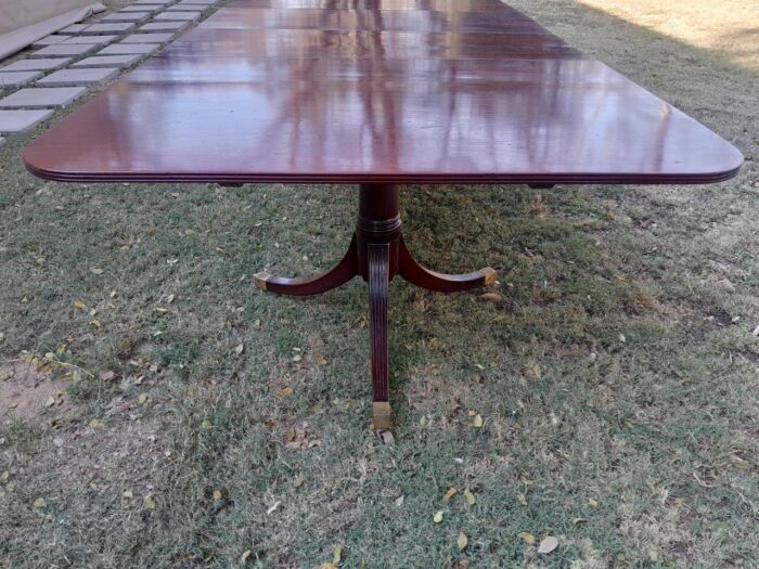 A 20th Century Mahogany Dining Table with Two Extensions and Brass Feet & Casters - Image 14