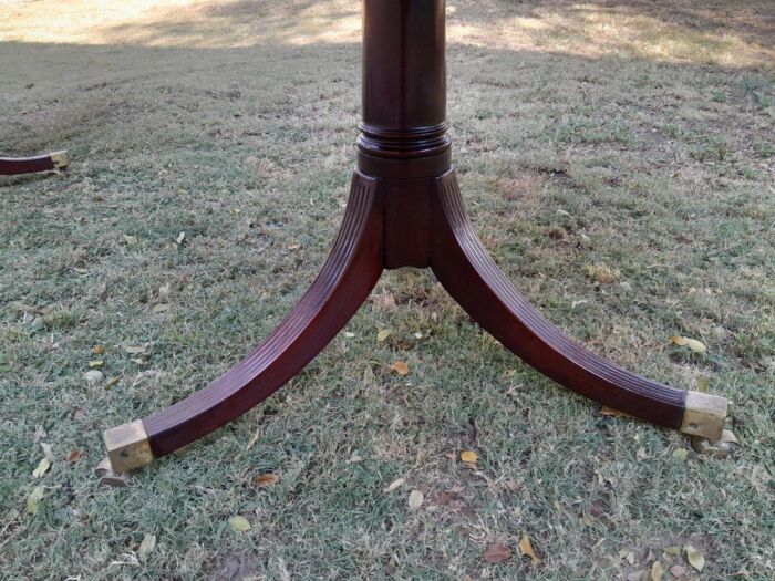 A 20th Century Mahogany Dining Table with Two Extensions and Brass Feet & Casters - Image 15