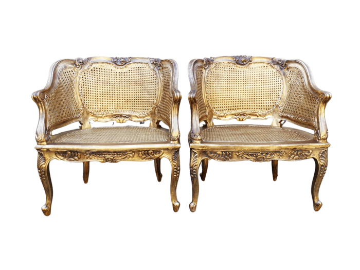 A 20th Century Pair or French Bergere Style Carved and Hand Gilded in Gold Leaf Wooden Chairs